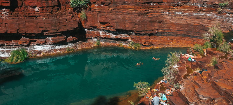 View of people swimming at Fortescue Falls in Dales Gorge at Karijini National Park