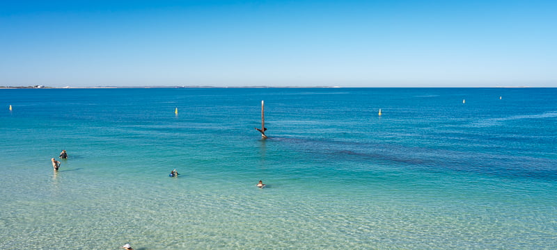 The Omeo Shipwreck mast sticking up out of the water at Coogee Beach
